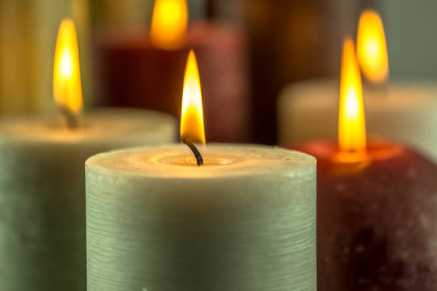 istock Many burning candles in different colors with a blurry background 859108062