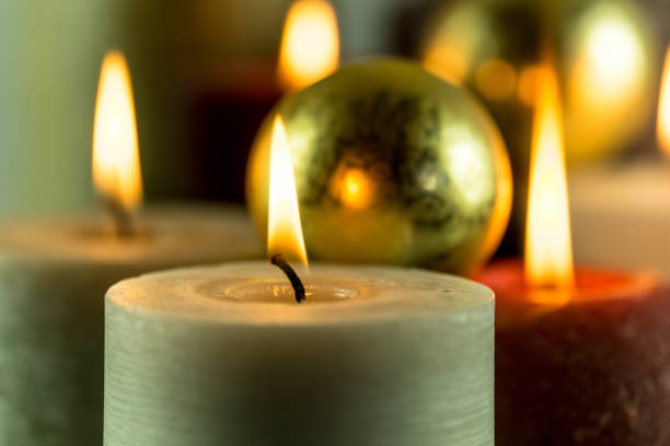 istock Many burning candles in different colors with a blurry background 859108286
