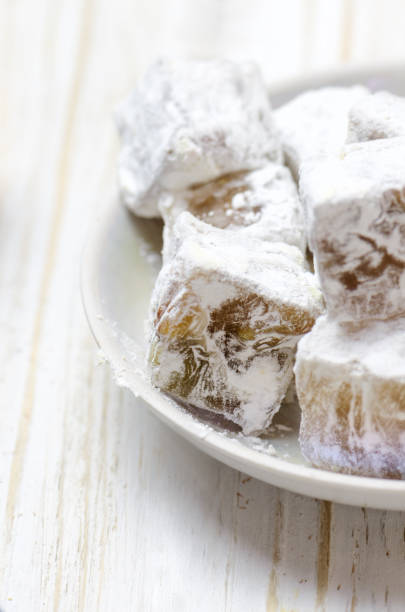 istock Turkish delight with pistachios on wooden background. 859108358