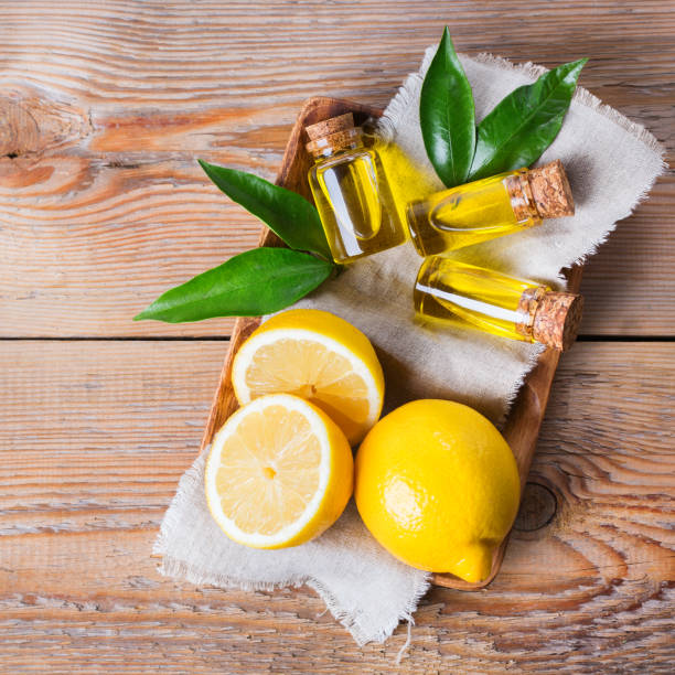 istock Organic essential lemon oil with green leaves and fruit 859111380