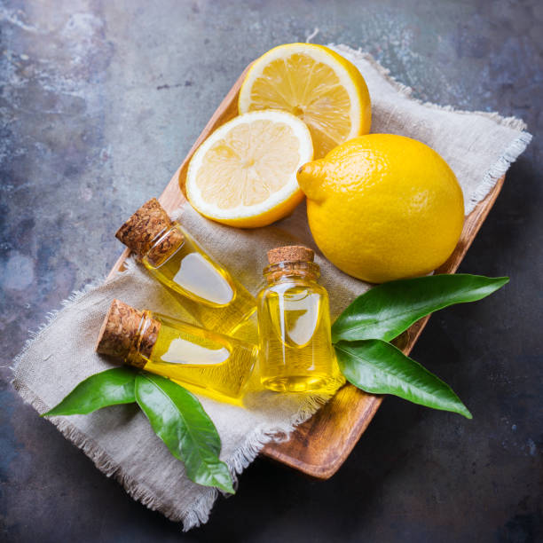istock Organic essential lemon oil with green leaves and fruit 859111492