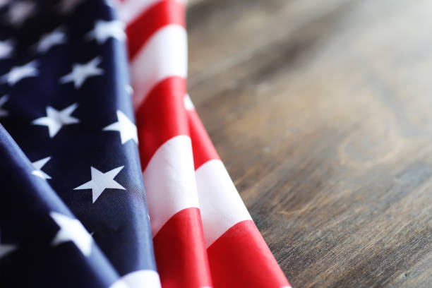 istock American flag on a wooden texture table 859111962