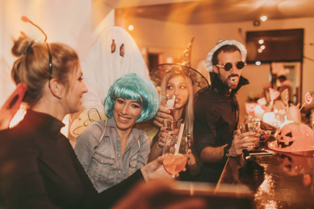 istock Friends on a Halloween party 859114604