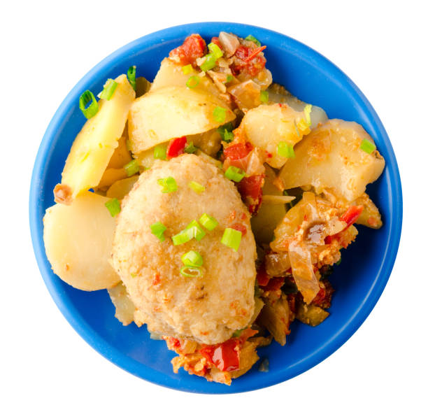 istock Cutlets with potatoes and stewed tomatoes. 859117894