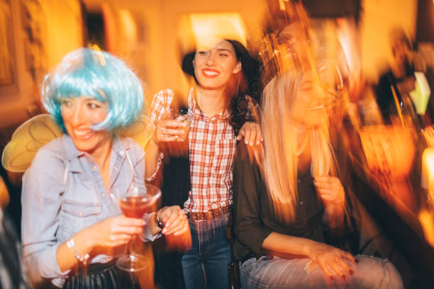 istock Girlfriends on a Halloween party 859119230