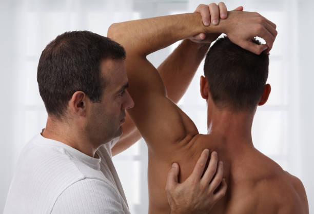 istock Chiropractic back adjustment. Osteopathy, Alternative medicine, pain relief concept. Physiotherapy, sport injury rehabilitation 859119390