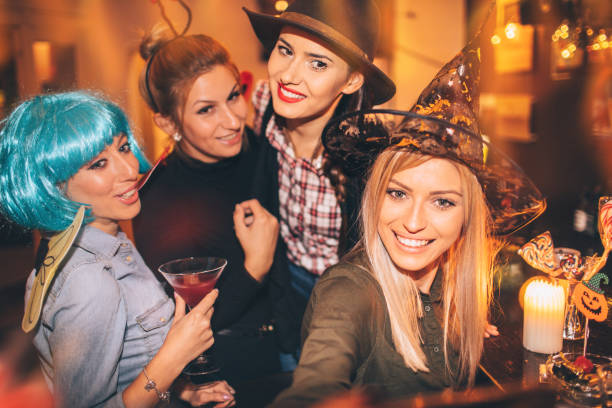 istock Girlfriends on Halloween party 859121726