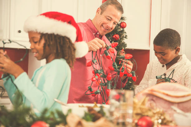 istock Multi-ethnic family in home kitchen decorating for Christmas. 859122232