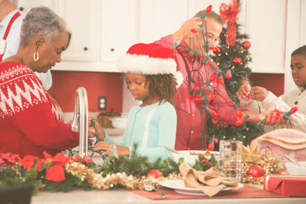 istock Multi-ethnic family in home kitchen decorating for Christmas. 859122416