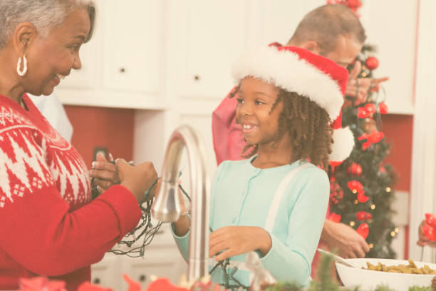 istock Multi-ethnic family in home kitchen decorating for Christmas. 859122846