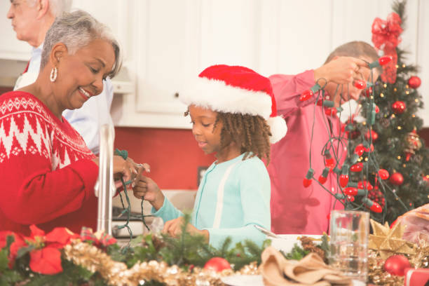 istock Multi-ethnic family in home kitchen decorating for Christmas. 859123104