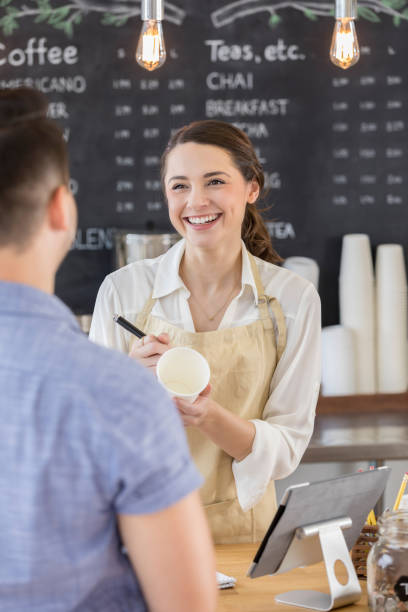 istock Beautiful coffee shop owner laughs at flirting customer 859123374