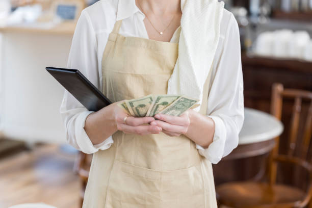 istock Unrecognizable coffee shop waitress counts bill payment 859123402