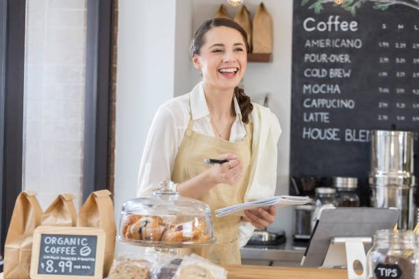 istock Cheerful coffee shop owner enjoys taking inventory 859123428