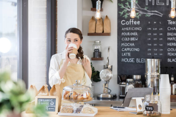 istock Female barista takes a break while working in coffee shop 859123478