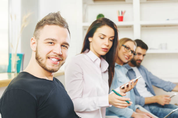 istock Men and women using cellphone and laptop 859126716