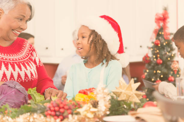 istock Multi-ethnic family gather in home kitchen at Christmas. 859132462