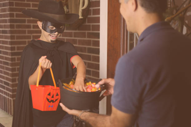 istock Little boy trick or treating on Halloween. 859133232