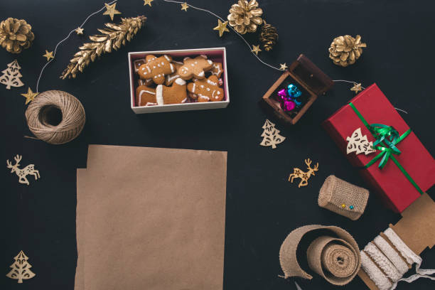 istock Gifts boxes with fir branches on black background top view 859138594