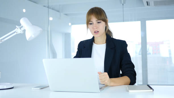 istock Angry Young Female at Work, Reacting to Loss 859139468