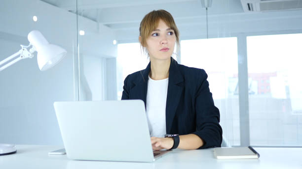 istock Young Female Waiting at Work, Watching Time on smartwatch 859139504