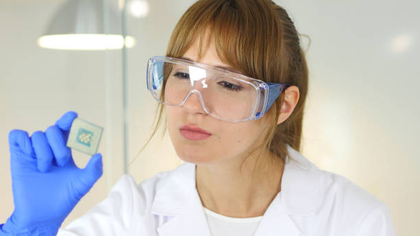 istock Female Scientist Examining New Chip of Computer 859139828