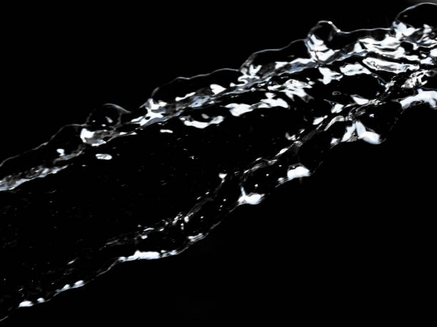 istock stream of water on a black background 859143420