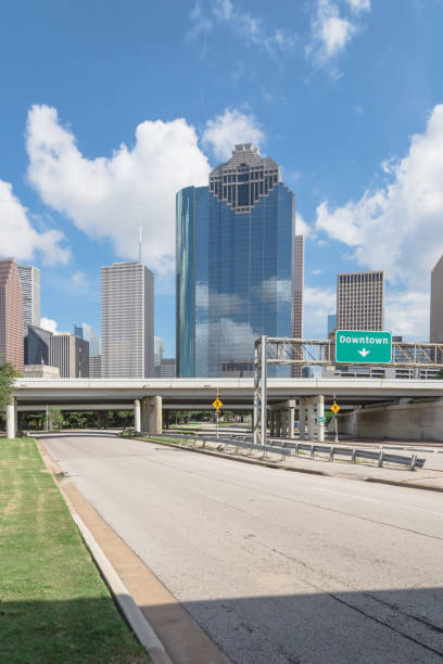 istock Downtown Houston from Allen Parkway under cloud blue sky 859149320