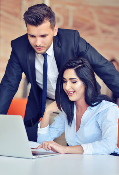 istock business couple in an office working on the computer 859156124