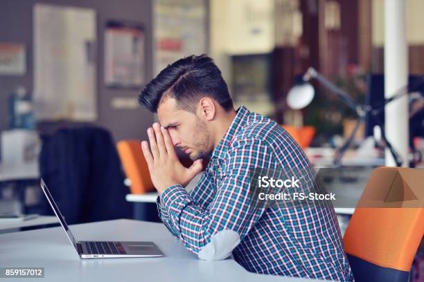 Businessman Feeling Headache While Doing Distance Work In Coffee Shop Tired With Failure Of Plans Stock Photo - Download Image Now