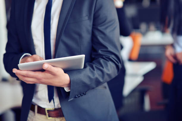 istock businessman holding digital tablet in office 859157128