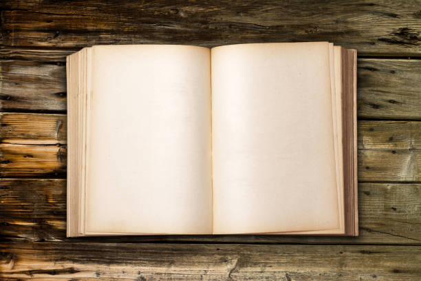 istock Old Antique Book on wood table 859160456