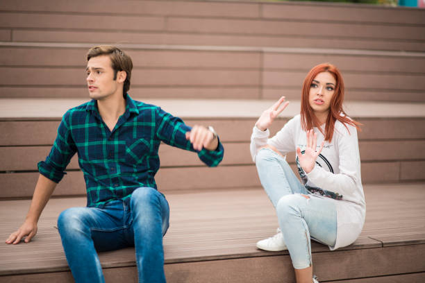 istock Young couple fighting while sitting on the stairs 859168534