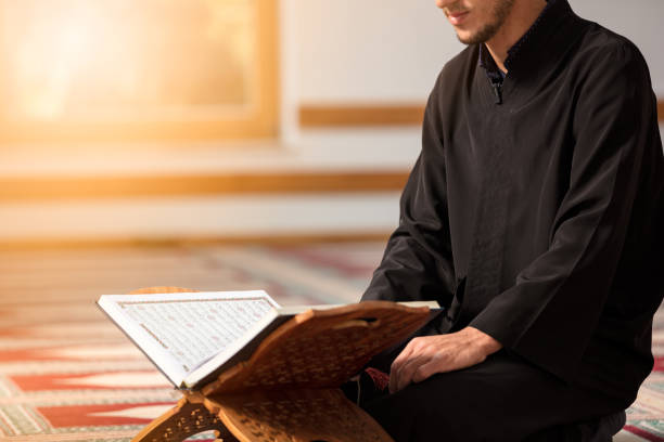 Religious muslim man praying inside the mosque