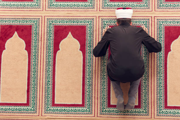 istock Top view of a religious muslim man praying inside the mosque 859180556