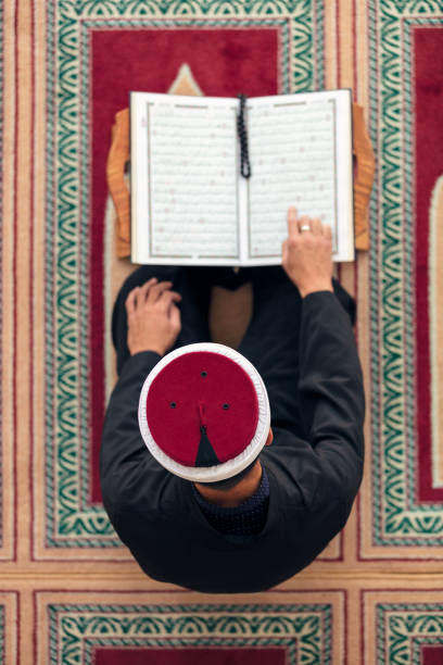 istock Top view of a religious muslim man praying inside the mosque 859183342