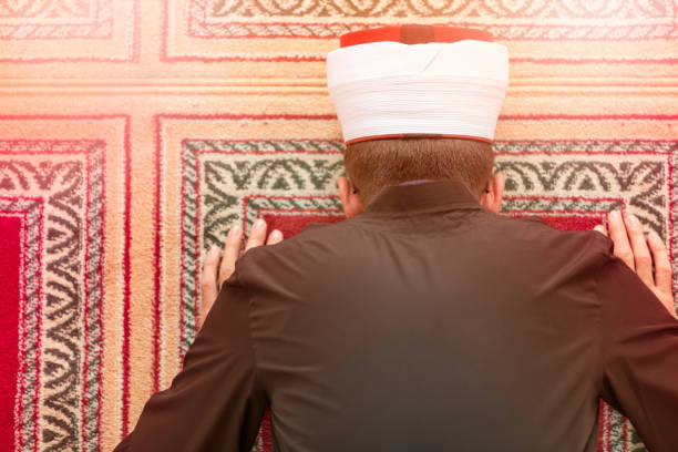 istock Top view of a religious muslim man praying inside the mosque 859183372