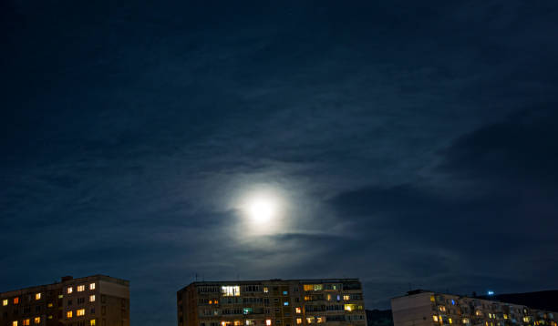 istock the big bright moon hanging over the city, 859183494