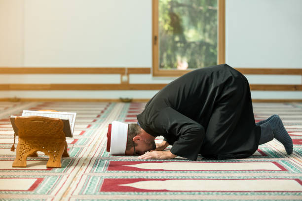 istock Young Imam praying inside of beautiful mosque 859192566