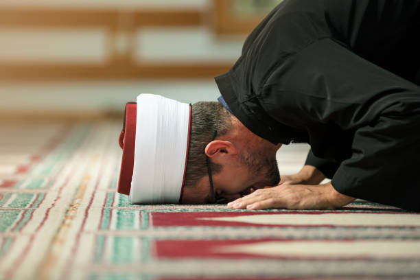 istock Young Imam praying inside of beautiful mosque 859192652