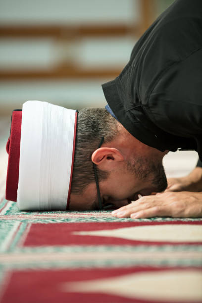 istock Young Imam praying inside of beautiful mosque 859192678