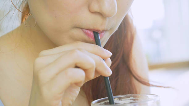 istock Young Asian lady drinking ice coffee 859193214