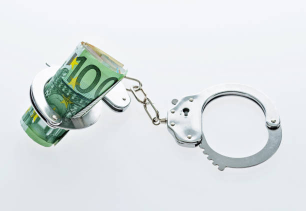 European union currency in handcuffs