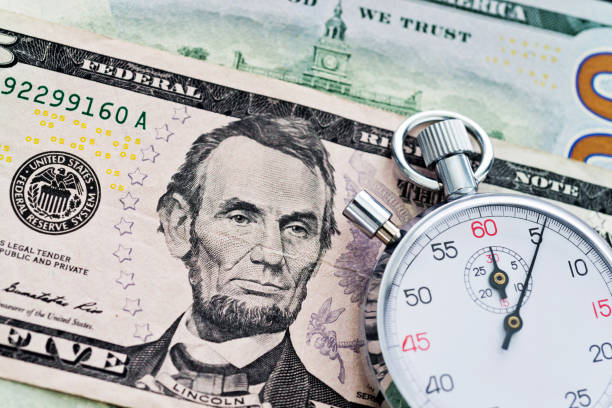 istock Stopwatch on the US dollars 859195878