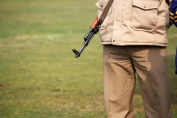 Indian police with AK-47 secure the area