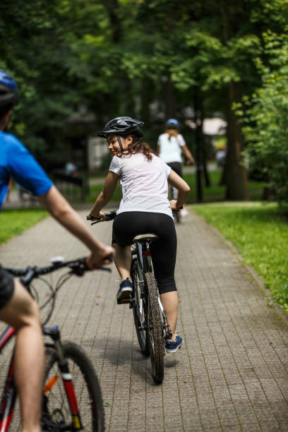 istock Urban biking- three people riding bikes in city 859210856