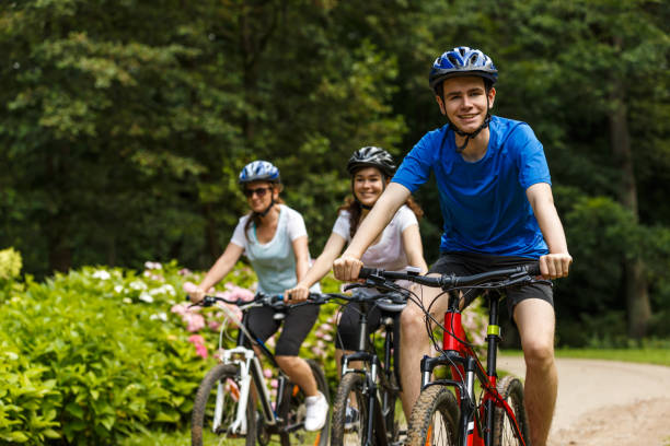 istock Urban biking- three people riding bikes in city 859210878
