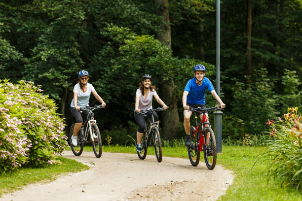 istock Urban biking- three people riding bikes in city 859210886