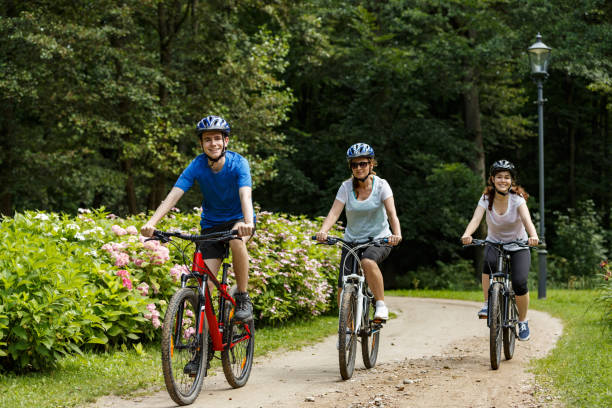 istock Urban biking- three people riding bikes in city 859210902