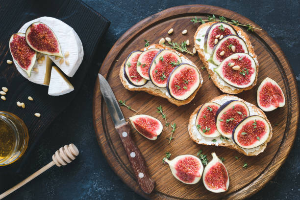 istock Toast or bruschetta with fresh figs, white cheese and honey 859216824